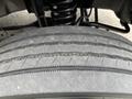 Close-up of a tire on a 2010 Ford F-550 Super Duty showing tread patterns and wear with a visible rubber surface