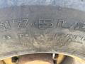 Tread details and specifications of a tire on a 2011 Case 570 MXT including size 17.5L-24 and 8 ply rating