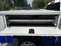 A 2017 Chevrolet Colorado with an open truck bed featuring a sliding storage drawer and metal frame inside