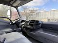 Interior view of a 2014 Hino 195 showing the driver's seat dashboard and gear shifter with an organized layout