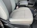 Close-up of the cloth driver's seat in a 2017 Ford F-250 SD with a simple design and grey color