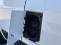 Close-up of the fuel cap on a 2020 RAM ProMaster 3500 showing the open cover and the fuel inlet without any visible fuel present