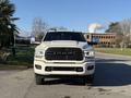 A 2023 RAM 3500 truck is prominently displayed from the front featuring a bold grill with the RAM logo and distinct headlights