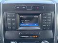 Interior dashboard display of a 2017 Ford F-550 showing radio controls and a digital clock