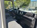 Interior view of a 2020 Hino 338 truck showing the dashboard steering wheel gear shifter and seat
