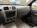 Interior view of a 2012 GMC Canyon dashboard featuring audio system climate controls and air vents