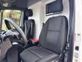 A 2020 Mercedes-Benz Sprinter 2500 interior featuring a driver seat and passenger seat both with black fabric upholstery and a steering wheel visible in the foreground