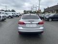 A silver 2018 Ford Focus viewed from the rear with no visible license plate and a sleek design