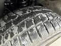 Close-up of a 2018 Chevrolet Colorado tire showing a rugged tread pattern designed for traction and stability on various terrains