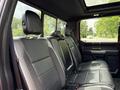 The interior of a 2019 Ford F-150 showing black leather rear seats and headrests with a modern design