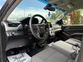 Interior view of a 2017 Chevrolet Tahoe showing the driver's seat steering wheel and dashboard with controls and a thank you mat on the floor