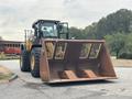 A 2012 Caterpillar 980 front loader with a large bucket attachment facing forward