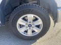 A close-up of a 2017 Ford F-150 tire and alloy wheel showcasing the Goodyear logo on the tire sidewall and a silver wheel design with five spokes