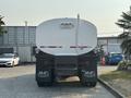 A 2016 Freightliner M2 106 truck with a round tank at the rear featuring a hose and marked with the AMG logo
