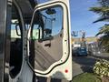 2022 Freightliner M2 106 truck door open showing interior details and driver's side mirror