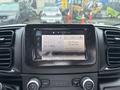Dashboard of a 2023 RAM Promaster 3500 featuring a touchscreen display showing radio frequency and device connection status