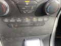 The dashboard control panel of a 2017 Ford Edge showing climate controls including fan settings and temperature adjustments
