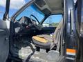Interior view of a 1996 GMC Top Kick truck showing the driver's seat steering wheel and dashboard