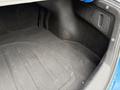 A spacious trunk of a 2021 Kia Forte with a flat floor and textured lining