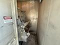 A 2011 Freightliner M2 106 truck with a loading area filled with equipment and debris showing signs of wear and use