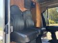 Interior view of a 2008 Workhorse W62 featuring two black leather seats with vertical stripes positioned side by side