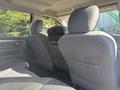 Interior of a 2014 RAM 5500 showing two front seats and the rear passenger area with fabric upholstery and a central console