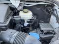 2022 Mercedes-Benz Sprinter engine compartment showing various components including the coolant reservoir hose and electrical connections