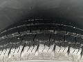 A close-up view of the tire tread of a 2021 Mercedes-Benz Metris showing detailed patterns and grooves designed for traction and performance