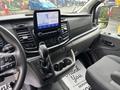 Interior view of a 2020 Ford Transit 250 showing the dashboard and center console with a touchscreen display and gear shift