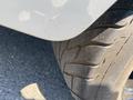 Close-up of a worn tire from a 1962 Ford 2WHDR showing tread patterns and dirt accumulation on the surface