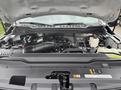 Engine compartment of a 2023 Ford F-450 Super Duty displaying the engine and various mechanical components