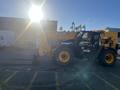 A 2013 JCB 510-56 Loadall with a yellow and black design is positioned with its telescopic arm and fork attachment visible