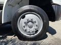 Close-up of a silver wheel on a 2011 International 4300 truck showing tire tread and lug nut configuration