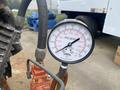 A pressure gauge labeled PEF Series with a needle indicating pressure levels ranging from 0 to 2000 kPa and marked with black and red numbers