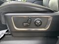 A seat adjustment control panel for a 2021 RAM 1500 featuring buttons for seat positioning with a sleek black design and metallic accents