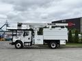 A 2021 Freightliner M2 106 bucket truck featuring a Terex aerial lift on the back and a white utility body with multiple compartment doors
