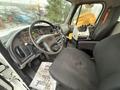 Interior view of a 2016 Freightliner 108SD showing the driver's seat dashboard and control panel