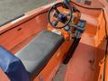 Interior view of a 2007 Fassmer 20 Foot Fast Rescue Boat featuring an orange seat control panel and steering wheel