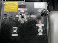Control panel with labeled levers for plow controls dump box and tailgate lock