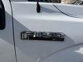 A chrome badge displaying "F-150 XLT" attached to the side of a 2018 Ford F-150