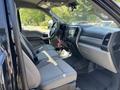 Interior view of a 2022 Ford F-350 SD showing two front seats and the dashboard with controls and infotainment system