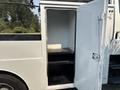 A 2006 Sterling Acterra with an open storage compartment showing two black shelves inside