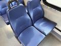A pair of blue fabric-covered seats designed for passenger transport with a textured surface and ergonomic shape