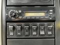 The image shows the control panel of a 2011 International 4400 featuring dials buttons and an LCD display for clock and various functions