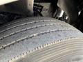 Close-up of a tire on a 2008 Kenworth T370 showing tread patterns and surface wear