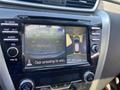 Screen displaying a rearview camera with guidelines showing a 2017 Nissan Murano parked in a space and surrounding obstacles