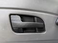Interior door handle of a 2011 International 4300 with a sleek design and a textured grip