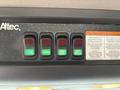 Control panel with four switches labeled as "F", "STROBE", "WORK LIGHT", and "TANK HEATER" on a 2013 Freightliner 114SD