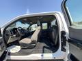 Interior view of a 2017 Ford F-250 SD showcasing the driver's side with gray seats and dashboard features visible