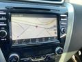 A 2017 Nissan Murano's dashboard display showing a map with a red location marker indicating position